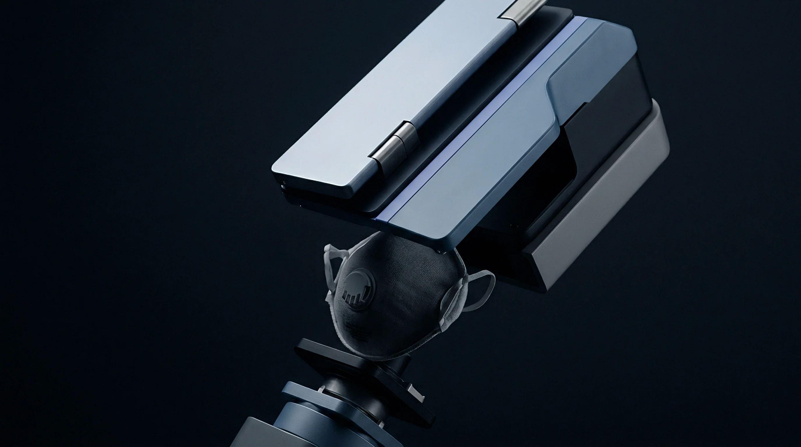 A rendered image shows a light grey smart device resting on a dark blue base unit, with a black respirator mask mounted below it.